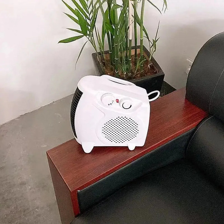 بخاری برقی فندار وارمتی مدل LQ-901 با توان 2000 وات و ترموستات قابل تنظیم و سیستم قطع خودکار Warmty electric fan heater model LQ-901 with 2000 watts of power, adjustable thermostat and automatic shut-off system